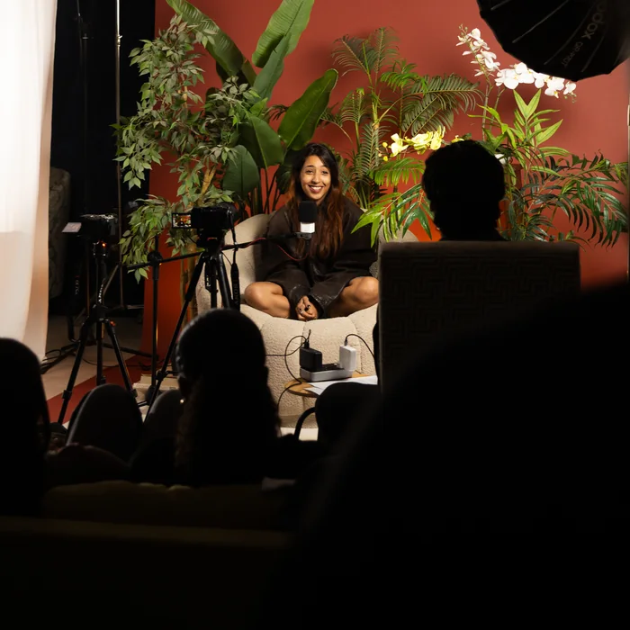 Behind the scenes on a Tiempo shoot, a team member filmed in the studio